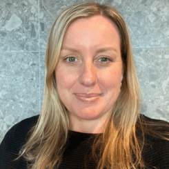 Photo of a blonde lady with a black shirt